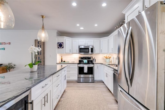 705 Berry Ct, Villa Rica, GA 30180 - kitchen featuring stainless steel appliances, white cabinets, wine cooler, light stone countertops, and crown molding