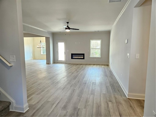 unfurnished living room with ceiling fan, light hardwood / wood-style floors, and crown molding