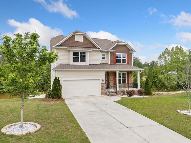craftsman house with a porch, driveway, an attached garage, and a front yard