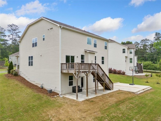 rear view of property featuring a patio area, a deck, a yard, and stairs