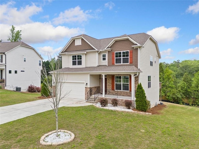 craftsman inspired home featuring covered porch, concrete driveway, an attached garage, and a front lawn