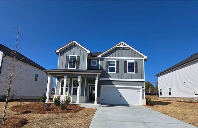 view of front facade with a garage and covered porch