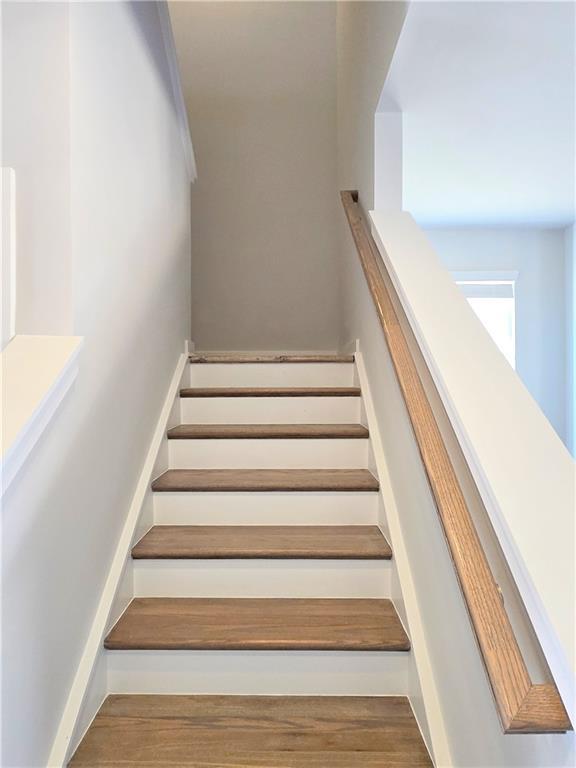 corridor with light colored carpet