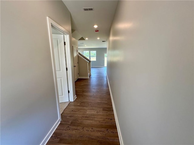 hallway featuring dark wood-type flooring