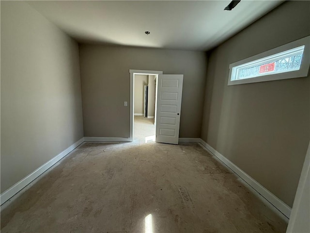 empty room with baseboards