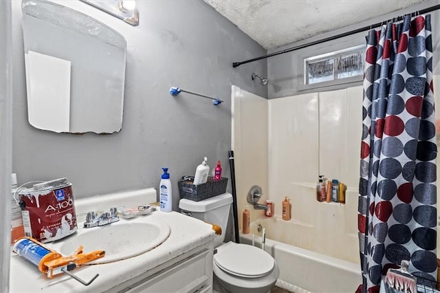 full bathroom with shower / bathtub combination with curtain, vanity, a textured ceiling, and toilet