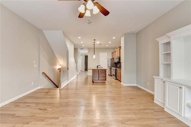 unfurnished room with recessed lighting, baseboards, light wood-style flooring, and ceiling fan