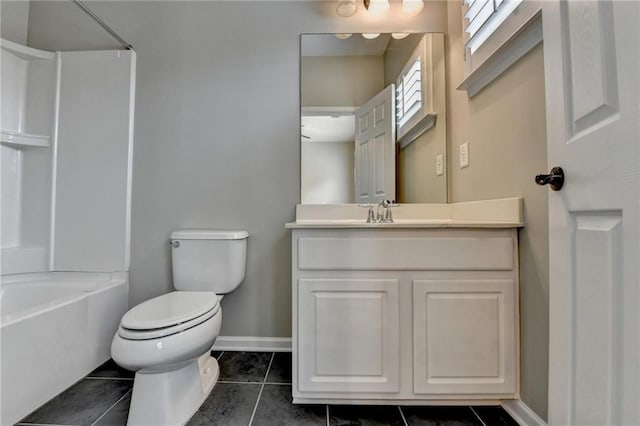 bathroom with toilet, tile patterned flooring, baseboards, bathtub / shower combination, and vanity