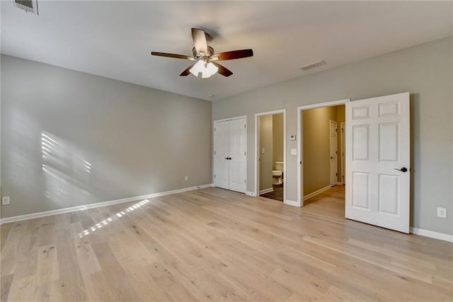 unfurnished bedroom with visible vents, baseboards, and light wood finished floors