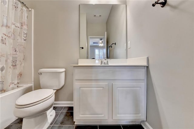 bathroom featuring tile patterned flooring, baseboards, toilet, shower / tub combo with curtain, and vanity