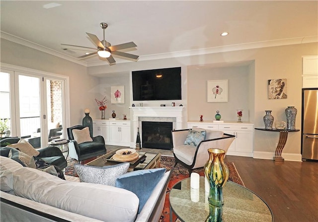 living room with crown molding, ceiling fan, and dark hardwood / wood-style flooring