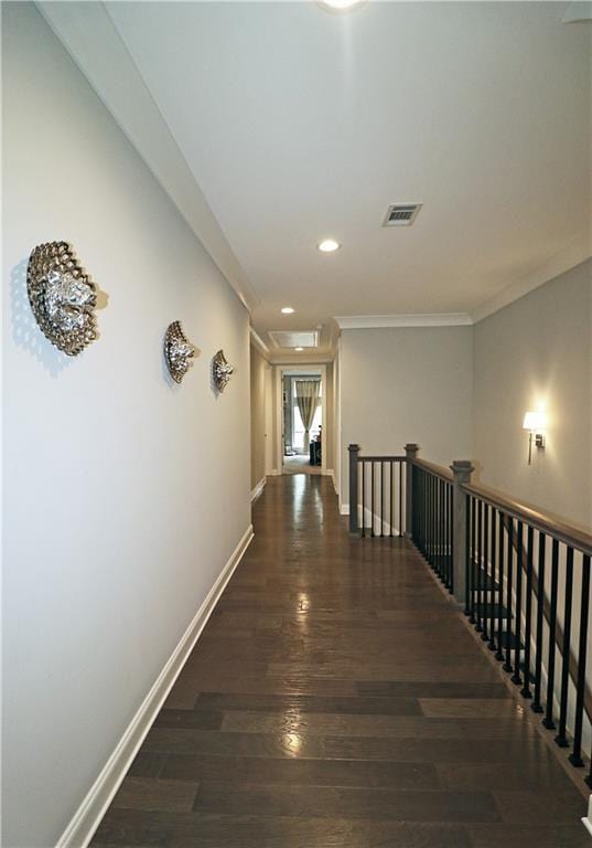 hallway featuring dark hardwood / wood-style floors and ornamental molding