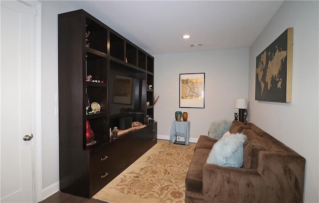 living area with dark hardwood / wood-style flooring