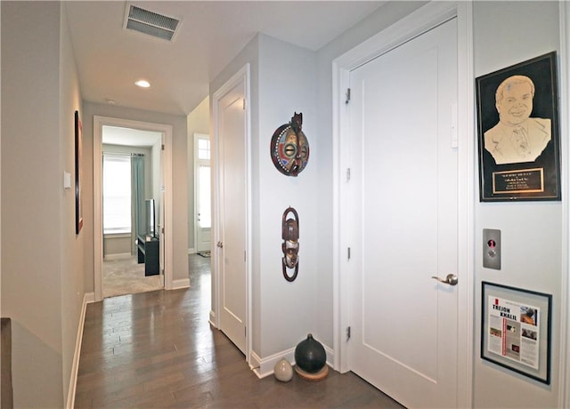 corridor featuring dark hardwood / wood-style floors