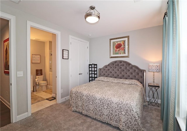 carpeted bedroom with ensuite bath