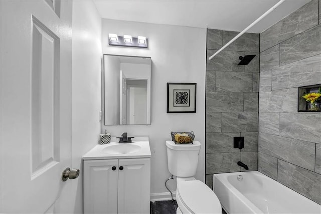 full bathroom with toilet, tiled shower / bath combo, and vanity