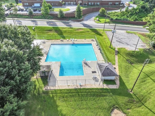 view of pool featuring a yard and a patio