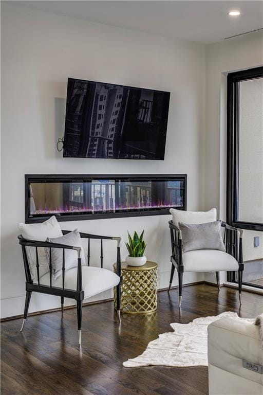 sitting room with hardwood / wood-style floors