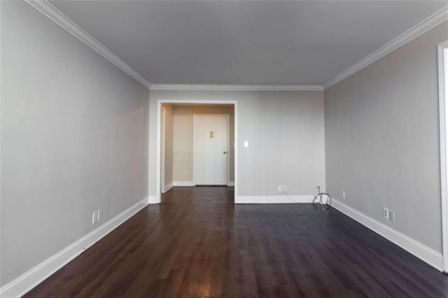 unfurnished room featuring dark hardwood / wood-style floors and crown molding