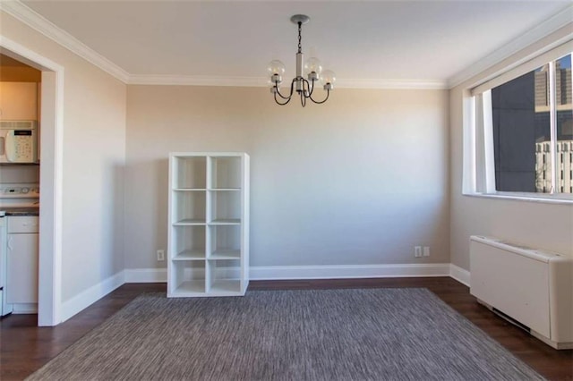 unfurnished dining area with an inviting chandelier, ornamental molding, dark hardwood / wood-style floors, and radiator heating unit