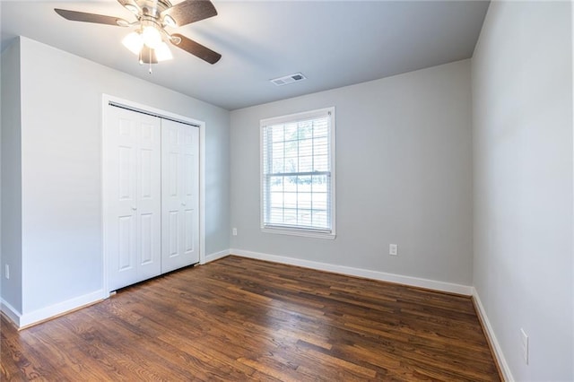2010 2nd Ave, Decatur, GA 30032 - unfurnished bedroom featuring dark wood-style floors, a closet, and a ceiling fan