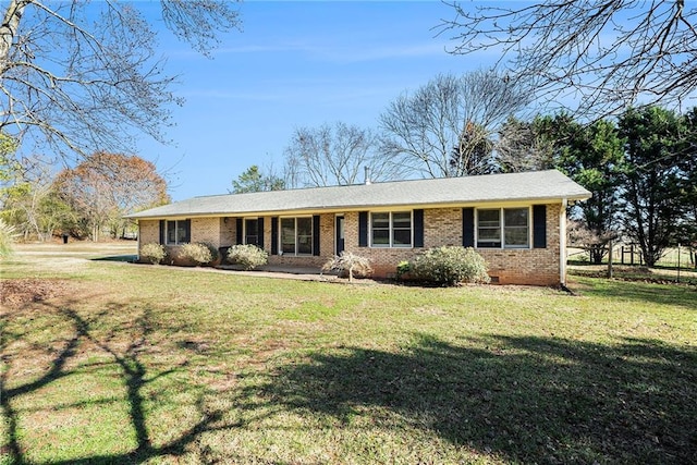 ranch-style house with a front lawn