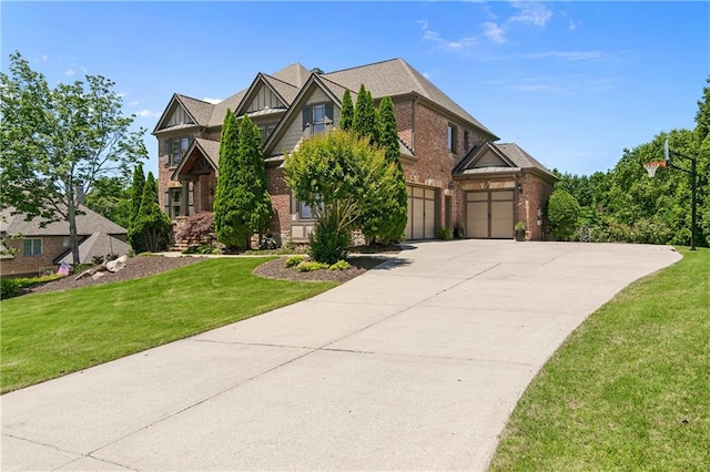 view of front of home featuring a front yard and a garage