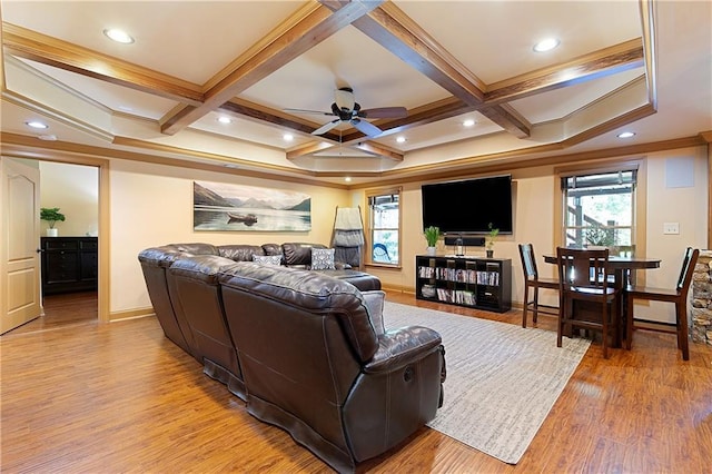 living room with coffered ceiling, ceiling fan, light wood-type flooring, ornamental molding, and beamed ceiling