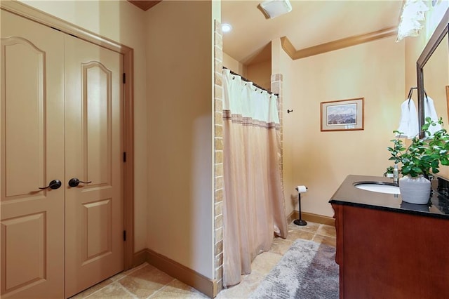 bathroom featuring vanity and a shower with shower curtain