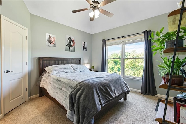 bedroom featuring ceiling fan and light colored carpet