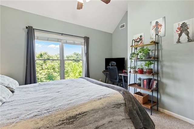 bedroom with ceiling fan, lofted ceiling, and carpet floors