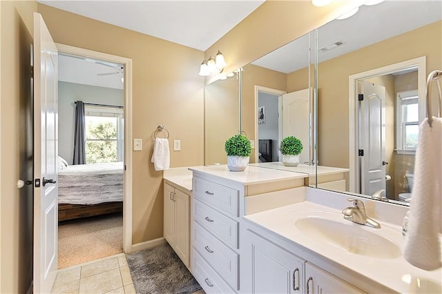 bathroom with ceiling fan, vanity, and tile patterned floors