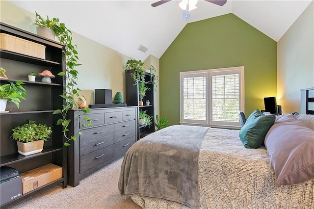 carpeted bedroom with ceiling fan and lofted ceiling