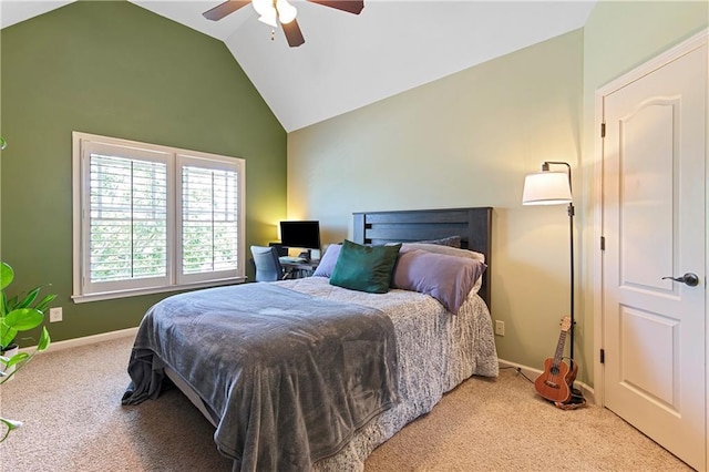 carpeted bedroom with ceiling fan and lofted ceiling