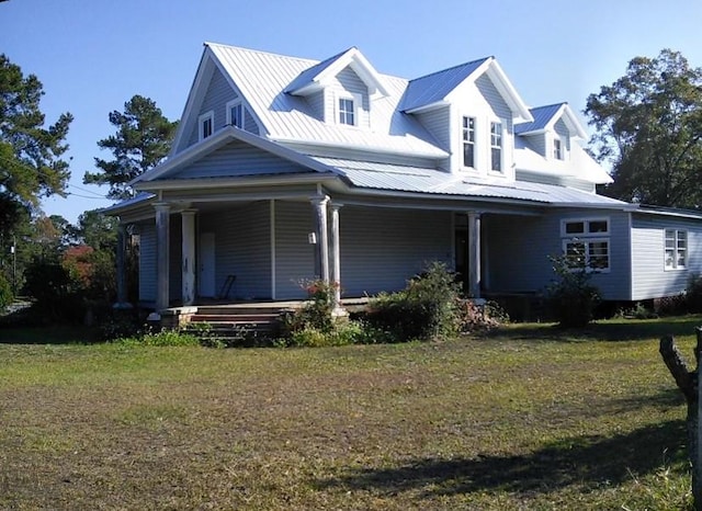 view of front of property with a front yard and a porch