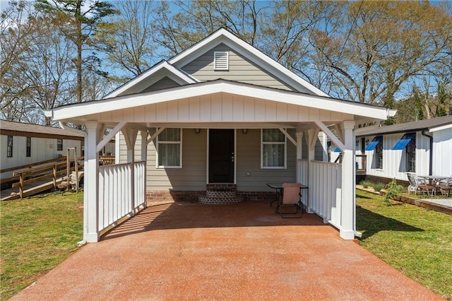 bungalow-style home featuring a front yard