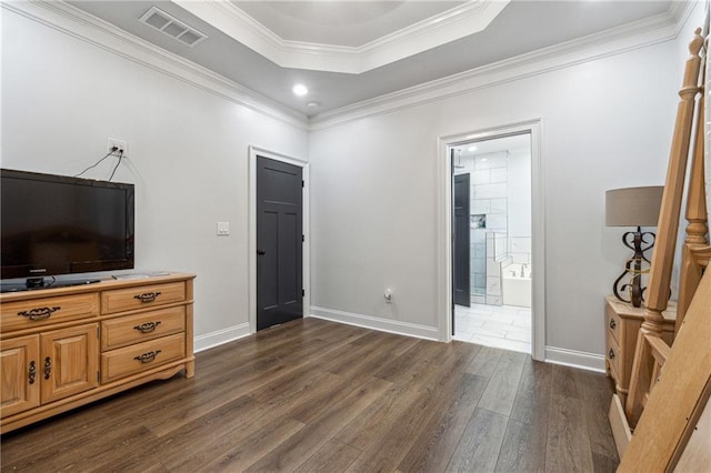 living room featuring visible vents, crown molding, baseboards, dark wood-type flooring, and a raised ceiling