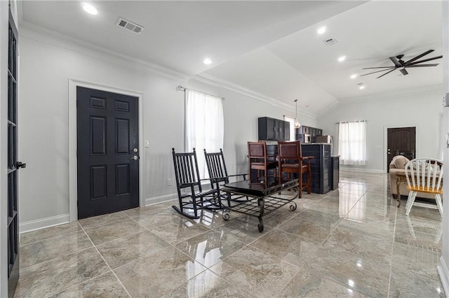 interior space featuring baseboards, plenty of natural light, and ornamental molding