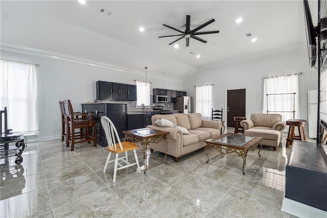 living area with ceiling fan, visible vents, ornamental molding, and a healthy amount of sunlight