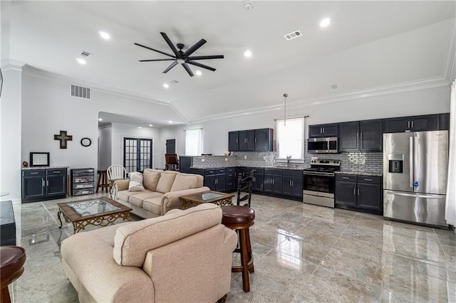 living room with crown molding, ceiling fan, and visible vents