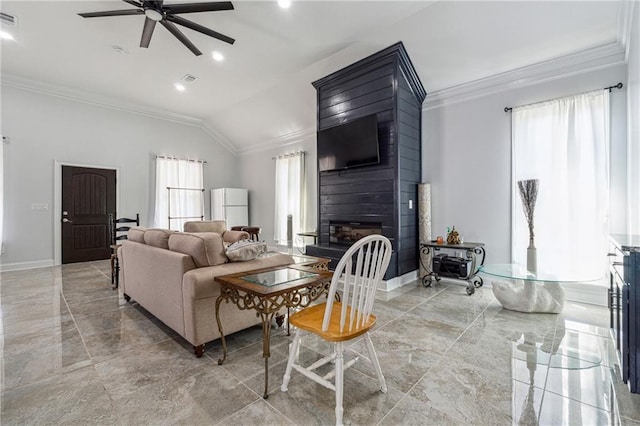 living room with ornamental molding, marble finish floor, a fireplace, ceiling fan, and vaulted ceiling