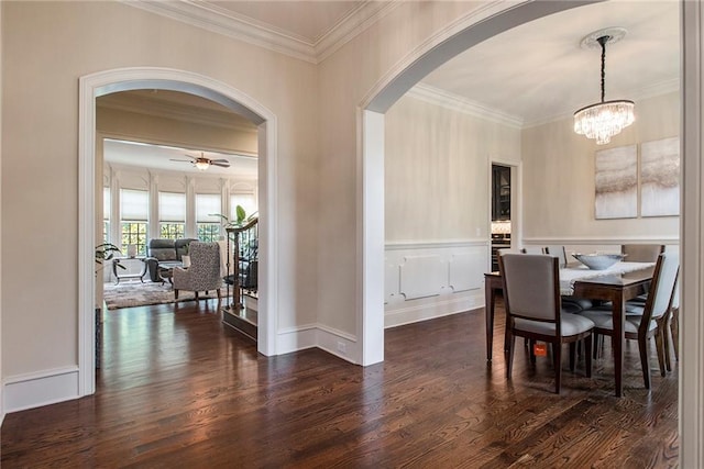 3015 Southmoor Trce, Roswell, GA 30075 - dining space featuring ornamental molding, arched walkways, dark wood finished floors, a ceiling fan, and a chandelier