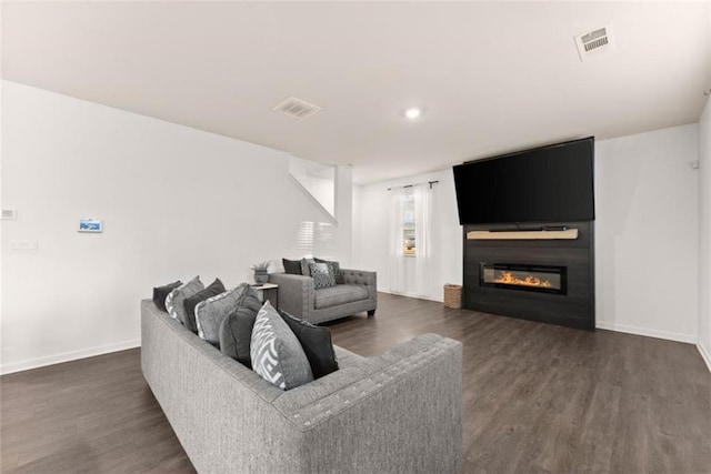 living room featuring dark hardwood / wood-style floors