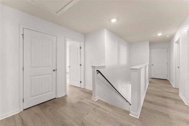 corridor with light wood-type flooring