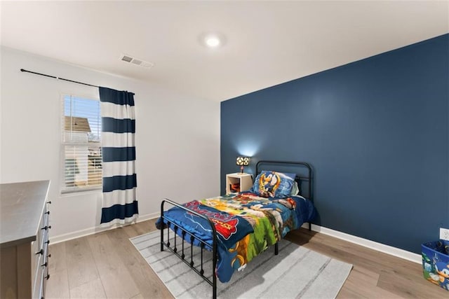 bedroom featuring light hardwood / wood-style floors