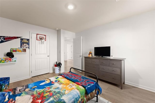 bedroom featuring light hardwood / wood-style floors