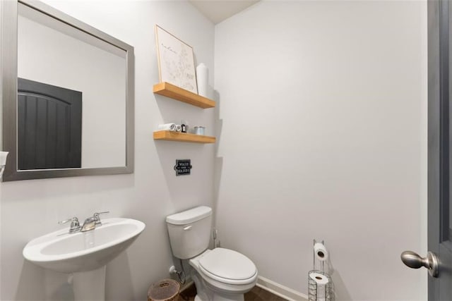 bathroom with toilet and sink