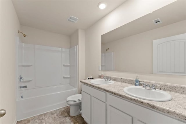 full bathroom featuring vanity, bathing tub / shower combination, and toilet