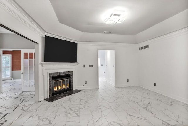 2983 Crosswycke Forest Dr, Brookhaven, GA 30319 - unfurnished living room featuring a tray ceiling, marble look tile flooring, baseboards, and a premium fireplace