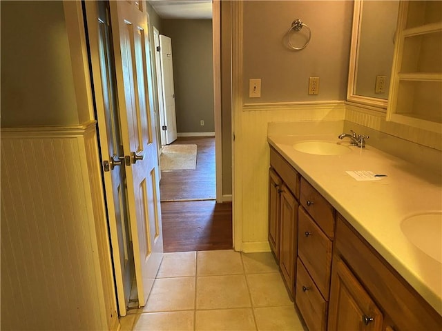 3794 W Hayward Ct, Tucker, GA 30084 - bathroom with a wainscoted wall, double vanity, and tile patterned floors